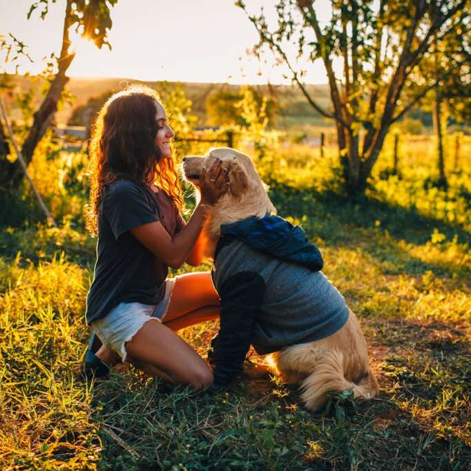 Girl loving on her dog